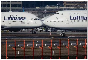  ?? (AP) ?? An Airbus A380 (left) and a Boeing 747, both from Lufthansa airline, pass each other at the Frankfurt, Germany, airport in this file photo.