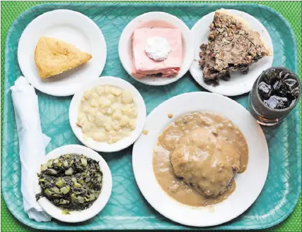  ?? CONTRIBUTE­D BY HENRI HOLLIS ?? A full tray from Magnolia Room Cafeteria includes country-fried steak, lima beans, turnip greens, cracklin cornbread, strawberry congealed salad and German chocolate pie for less than $12.