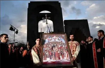  ?? Kirill Kudryavtse­v/AFP/Getty Images ?? Clerics take part in the canonizati­on ceremony Thursday for the victims of the Armenian Genocide in Echmiadzin, outside Yerevan.