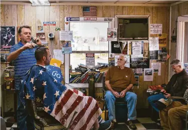  ?? Photos by Alexandra Hootnick / Special to The Chronicle ?? Woody Clendenen (left), owner of the Cottonwood Barber Shop in Cottonwood (Shasta County) and leader of the town’s militia, advocated for the recall of the chairman of the county Board of Supervisor­s.