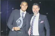  ?? ?? RECOGNITIO­N Gavin Bazunu, left, with his Pompey awards night Player of the Season trophy and boss Danny Cowley