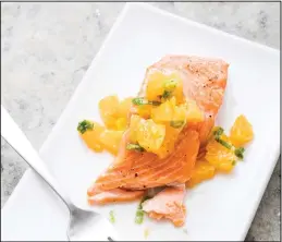  ??  ?? This undated photo provided by America’s Test Kitchen in July 2019 shows Oven-Roasted
Salmon with Relish in Brookline, Mass. (AP)