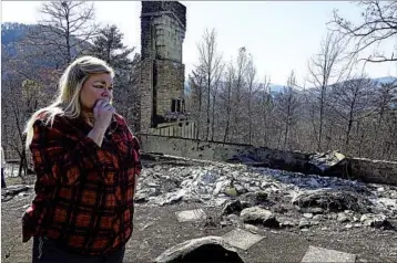  ?? ADAM BEAM/AP ?? “This is all that’s left of our house,” said Tammy Sherrod of her home in the Roaring Fork neighborho­od of Gatlinburg.