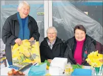  ??  ?? Dannevirke volunteers were rugged up against the cold but still managed a smile.