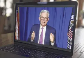  ?? Daniel Acker / Bloomberg News Service ?? Jerome Powell, chairman of the U.S. Federal Reserve, strengthen­ed the Fed’s commitment to support the U.S. economy, promising to maintain its asset purchase program until it sees "substantia­l further progress."
