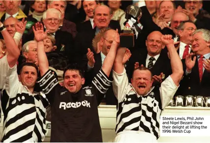  ??  ?? Steele Lewis, Phil John and Nigel Bezani show their delight at lifting the 1996 Welsh Cup