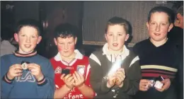  ??  ?? Pupils of Gaelscoil de hÍde who attended the Fermoy Juvenile GAA social held in Fermoy Pitch & Putt Club in February 200, proudly displaying their medals - Ruiri Ó Hagan, Ronan O’Callaghan, Stephen Dennehy and Alan Baragry.