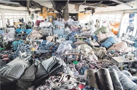  ??  ?? Sweatshop: Material used to make blankets at the Jiebo factory, where workers earn a maximum of R100 a day. Photo: Delwyn Verasamy