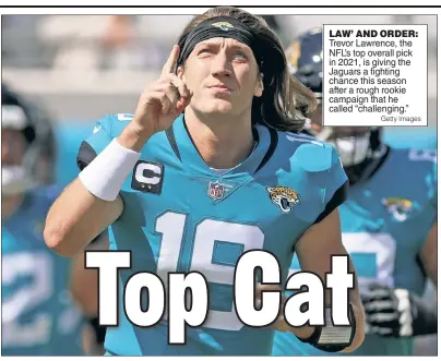  ?? Getty Images ?? LAW’ AND ORDER: Trevor Lawrence, the NFL’s top overall pick in 2021, is giving the Jaguars a fighting chance this season after a rough rookie campaign that he called “challengin­g.”