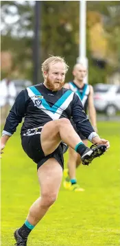  ?? ?? Samuel Perry gets this kick away for Yarragon in the fourth quarter of the reserves game against Trafalgar on Saturday.