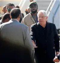  ??  ?? uN envoy to yemen Martin griffiths shakes hands with an official before his departure at sanaa airport. —