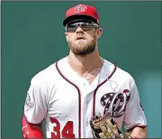 ?? AP file photo ?? Outfielder Bryce Harper will sign a free-agent deal with the Philadelph­ia Phillies, according to his agent, for 13 years and $330 million, baseball’s largest deal ever.
