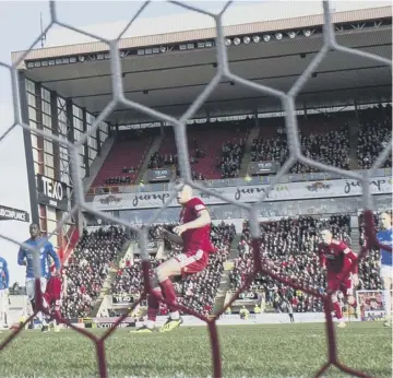  ??  ?? 2 1. Aberdeen take an early lead as Sam Cosgroves fires home from the penalty spot.2. Gary Mackaystev­en receives treatment after the incident which gave Aberdeen their penalty.3. It’s all square as Rangers’ Joe Worrall volleys home .4. Worrall celebrates his equalising goal