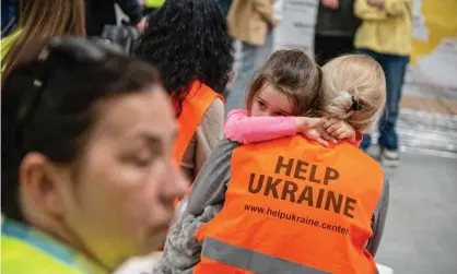  ?? Photograph: Wojtek Jargiło/EPA ?? Volunteers work at a reception point for Ukrainian refugees in Lublin, south-eastern Poland.
