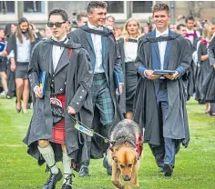  ?? ?? BIG DAY: Clockwise from left: St Salvator’s Chapel Choir; graduate Reise Watson, 22, with his guide dog Duke; a hug says it all; history graduate Alistair Robinson pipes the procession through the town.