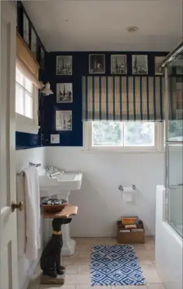  ?? TIM BEDDOW, INSPIRED BY ... ?? Baby De Silliers’ bathroom has a wall of photograph­s dedicated to fishing.