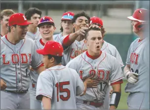  ?? DAVID WITTE/NEWS-SENTINEL ?? Lodi's Omar Plascencia (17) celebrates a two-run home run with his teammates during Lodi's 14-0 victory over Tokay at Zupo Field on May 7.