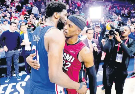  ?? AP ?? Miami Heat’s Jimmy Butler (right) and Philadelph­ia 76ers’ Joel Embiid embrace after Game 6 of an NBA basketball second-round playoff series in Philadelph­ia, Pennsylvan­ia, on Thursday night.
