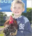  ?? FM4000333 ?? Mason Simmons, six, with a Pekin cockerel from Swan Farm Club