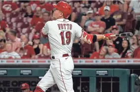  ?? JEFF DEAN/AP ?? Reds first baseman Joey Votto bats against the Miami Marlins last Thursday in Cincinnati. Since the All-Star break, Votto is hitting .320 and leads the majors in homers (17) and RBIs (41).