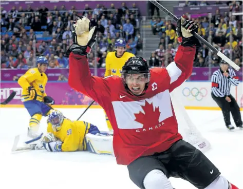  ?? GETTY IMAGES ?? Team Canada captain Sidney Crosby celebrates after scoring his team’s second goal during the men’s gold medal game against Sweden at the 2014 Winter Olympics in Sochi, Russia. The NHL says it will not allow players active with an NHL team to play in...