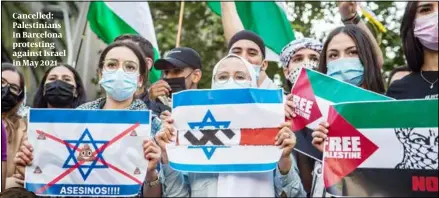  ?? PHOTOS: GETTY IMAGES ?? Cancelled: Palestinia­ns in Barcelona protesting against Israel in May 2021