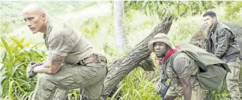  ?? WENN. COM ?? From left to right, Dwayne Johnson, Kevin Hart, and Nick Jonas in a scene from Jumanji: Welcome to the Jungle, which opens on Dec. 20.