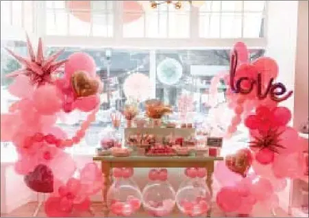  ?? PHOTO COURTESY ANNIE MALONEY ?? A photo from last year shows Sweet Annie’s Candy Shoppe in Ambler decorated for Valentine’s Day.