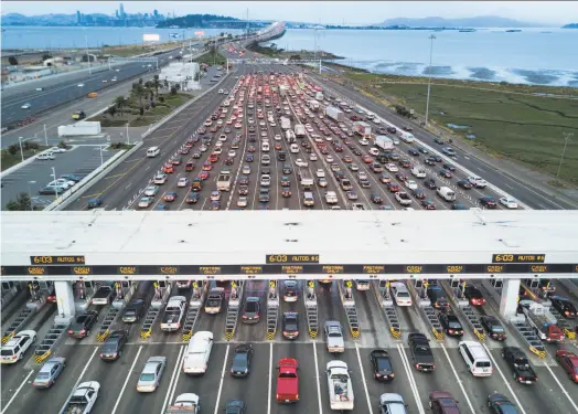  ?? Noah Berger / Special to The Chronicle 2017 ?? Traffic across the Bay Bridge and throughout the Bay Area is congested because workers must travel far from their homes to work. Changing work schedules to off hours or weekends would go a long way toward reducing traffic.