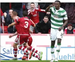  ??  ?? BLAME GAME: as Rooney (left) celebrates after equalising from the spot, Boyata (right) is still furious with the officials for awarding the penalty