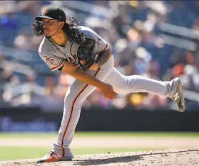  ?? Kelvin Kuo / Associated Press 2018 ?? Giants pitcher Dereck Rodriguez worked 1682⁄3 innings in the majors and minors combined last year. He hopes to pitch at least 200 in 2019.