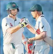  ?? AP ?? Australia captain Steve Smith (left) congratula­tes David Warner after he completed a halfcentur­y in Dhaka on Tuesday.