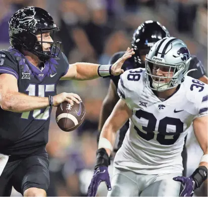  ?? ?? Kansas State defensive end Brendan Mott (38) chases down TCU quarterbac­k Max Duggan (15) during a 2022 game in Fort Worth, Texas. Mott is back for his senior season in 2024.