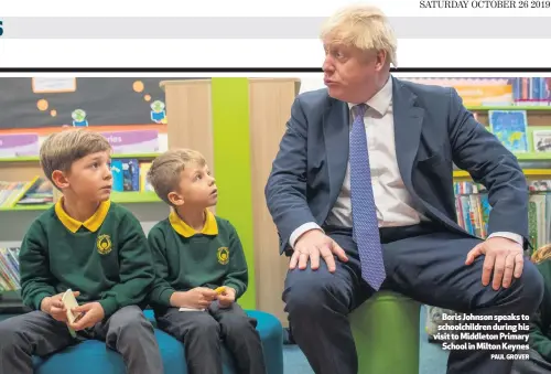  ?? PAUL GROVER ?? Boris Johnson speaks to schoolchil­dren during his visit to Middleton Primary
School in Milton Keynes