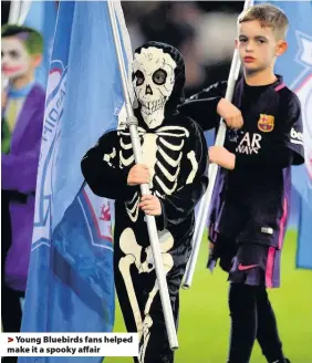  ??  ?? > Young Bluebirds fans helped make it a spooky affair