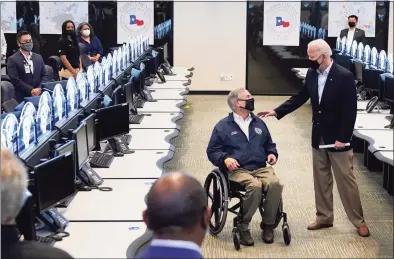  ?? Patrick Semansky / Associated Press ?? President Joe Biden talks with Texas Gov. Greg Abbott as they tour the Harris County Emergency Operations Center on Friday in Houston.