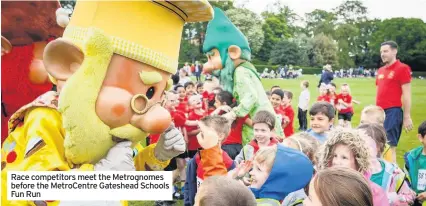  ??  ?? Race competitor­s meet the Metrognome­s before the MetroCentr­e Gateshead Schools Fun Run