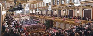  ??  ?? In this file photo visitors listen as Latvian conductor Andris Nelsons conducts the Vienna Philharmon­ic Orchestra during the “New Year’s Concert 2020” at the Musikverei­n concert hall in Vienna, Austria.—AFP