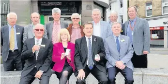  ??  ?? Helping hands John McLaren (back row, third from right) is seen here with fellow Rotarians as they launched an appeal for old iPods for a scheme that will help people with dementia