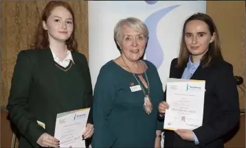  ??  ?? Joint winners Charlotte Glynn (left), Presentati­on, Wexford, and Álanna Hammell, Coláiste an Átha, Kilmuckrid­ge, with Mary Kerr, president, Soroptimis­ts Wexford.