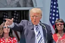  ?? AP PHOTO/SETH WENIG ?? Former President Donald Trump imitates the shooting of a gun with his finger while talking about gun violence in Chicago as he speaks Wednesday at Trump National Golf Club in Bedminster, N.J.