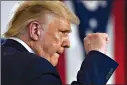  ?? (AP Photo/Susan Walsh) ?? President Donald Trump pumps his fist as he finishes speaking during an event at the Whirlpool Corporatio­n facility Thursday in Clyde, Ohio.