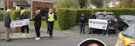  ??  ?? Protestors and gardaí outside the home of Minister Paul Kehoe (inset).