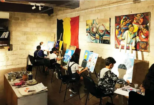  ??  ?? Young artists make paintings about World Expo Brussels 58 at the venue of the Arts Council Azerbaijan in the old city of Baku during the month of October. The paintings were shown to the public between October 23 and November 4 in Landmark Baku in the framework of a joint project between the Embassy of Belgium in Baku and the Art School of the Arts Council Azerbaijan. Image: Arts Council Azerbaijan.