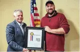  ?? ?? The Abilities Connection CEO Jim Zahora (left) and Mike Spada, TAC quality coordinato­r and veteran, display TAC’S fifth HIRE Vets Medallion Award.