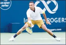  ??  ?? Nick Kyrgios, of Australia, returns to Kyle Edmund, of Britain, during the
Rogers Cup men’s tennis tournament on Aug 6 in Montreal. (AP)