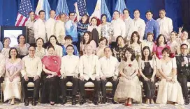  ??  ?? The Philippine Embassy staff in Washington D.C. pose for a family photo before the event