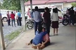  ?? MUNGKORN SRIBOONREU­NG RESCUE GROUP ?? In this image from video, a distraught woman is comforted outside the site of an attack at a day care center in the town of Nongbua Lamphu, northeaste­rn Thailand, on Thursday.