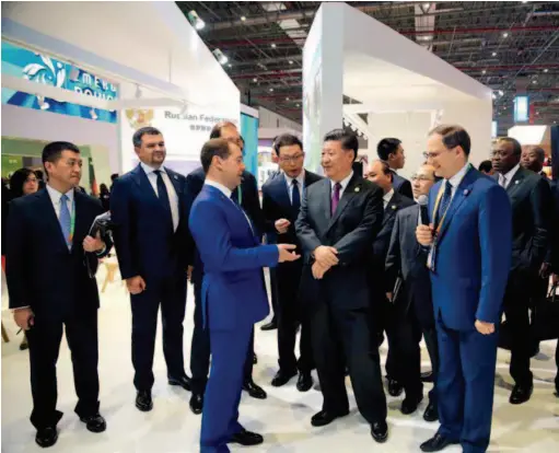  ?? China Daily ?? November 5, 2018: Russian Prime Minister Dmitry Medvedev introduces the Country Pavilion of Russia to Chinese President Xi Jinping as he and foreign leaders tour the exhibition venue of the first China Internatio­nal Import Expo in Shanghai. courtesy of