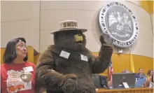  ?? LUKE E. MONTAVON/THE NEW MEXICAN ?? Smokey Bear visits the state Senate on Tuesday.